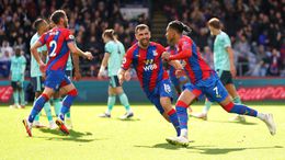 Michael Olise (right) celebrates scoring bringing Crystal Palace back into the game