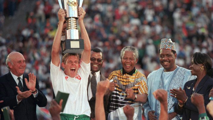Nelson Mandela sports South Africa's away shirt as Bafana Bafana lift the trophy