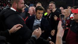 Scott Parker is mobbed after Bournemouth secured promotion back to the Premier League