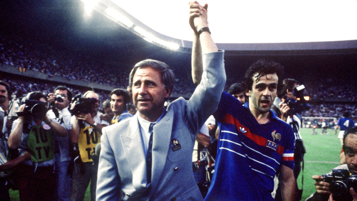 France coach Michael Hidalgo holds aloft captain Michel Platini's arm after the final of the 1984 European Championship