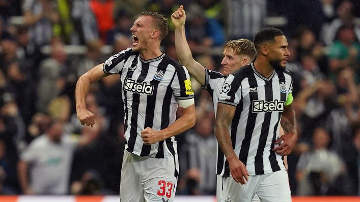 Dan Burn celebrates scoring Newcastle's second goal after a lengthy VAR check