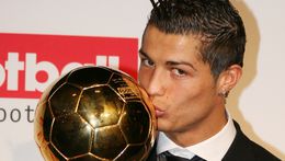 Cristiano Ronaldo kisses the trophy after winning his first Ballon d'Or in 2008