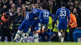 Raheem Sterling was mobbed by his team-mates after getting the ball rolling at Stamford Bridge