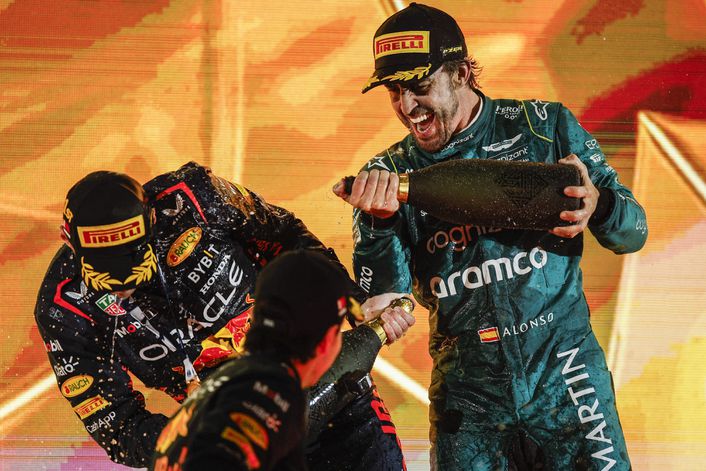 2023 Bahrain Grand Prix winner Max Verstappen gets a soaking from Aston Martin's Fernando Alonso