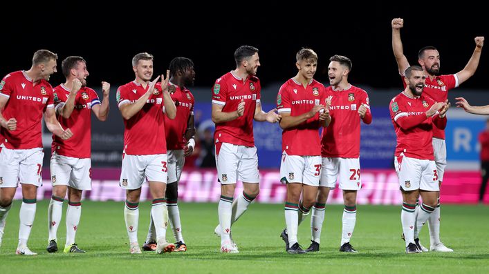 Wrexham celebrate their penalty win over Wigan