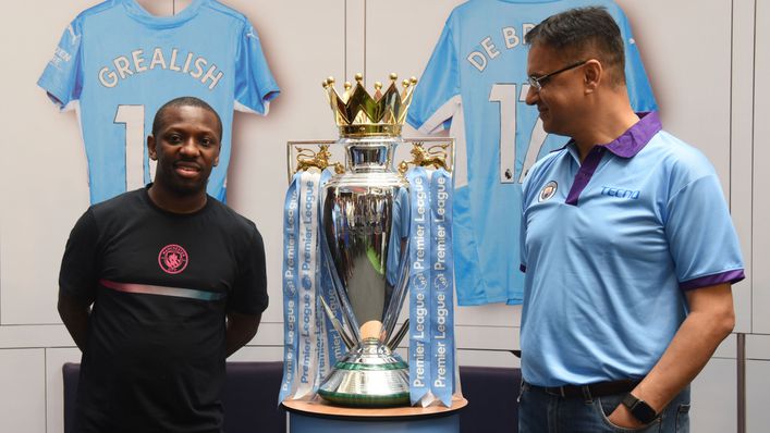 Shaun Wright-Phillips poses with Manchester City's Premier League trophy