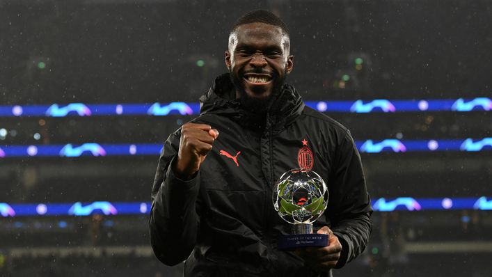 Fikayo Tomori poses with his Player of the Match award after AC Milan knocked Tottenham out of the Champions League