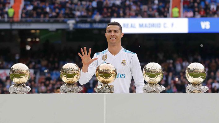 Cristiano Ronaldo poses with all five of his Ballon d'Or trophies after his 2017 win
