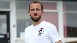 Harry Kane models England's pre-match shirt for the game against Scotland