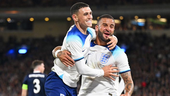 Phil Foden celebrates scoring the opening goal with Kyle Walker