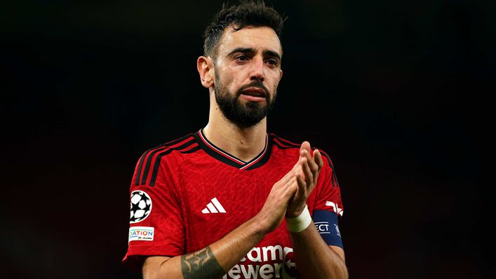 Bruno Fernandes applauds the Manchester United fans after Champions League exit