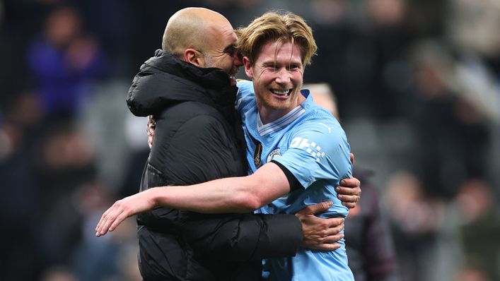 Kevin De Bruyne celebrates with Man City boss Pep Guardiola