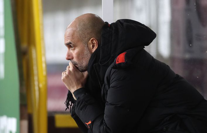 Pep Guardiola has played down talk of winning four trophies