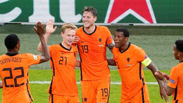The Netherlands celebrate after Wout Weghorst doubled their lead against Ukraine