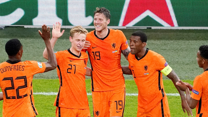 The Netherlands celebrate after Wout Weghorst doubled their lead against Ukraine