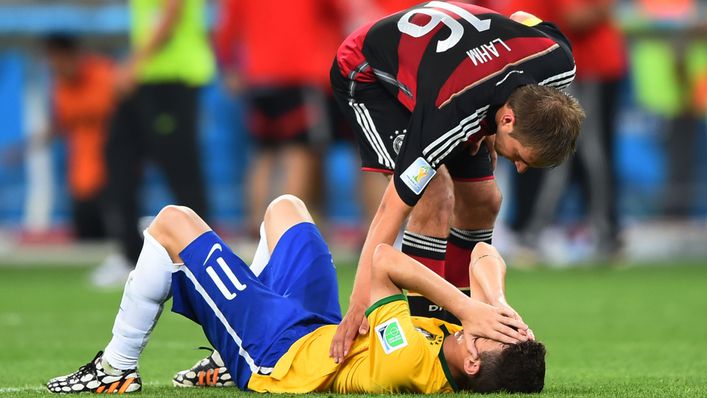 Germany captain Philipp Lahm comforts Brazil's Oscar after the game
