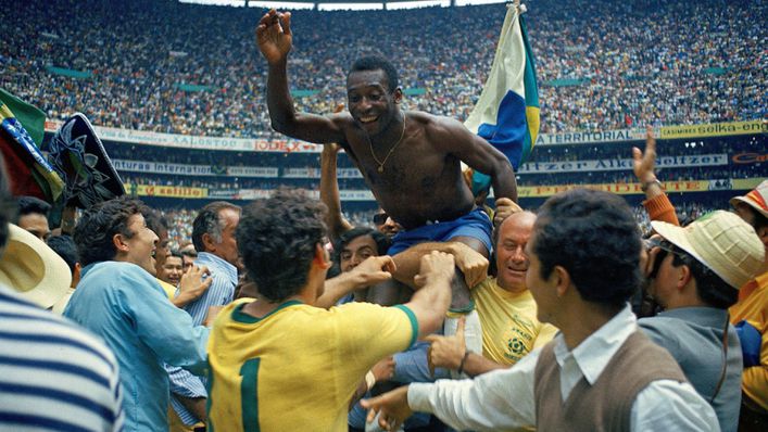 Pele is held aloft after the 1970 World Cup final