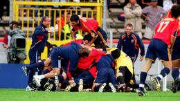 Spain celebrate Alfonso Perez's dramatic late winner against Yugoslavia with a pile-on