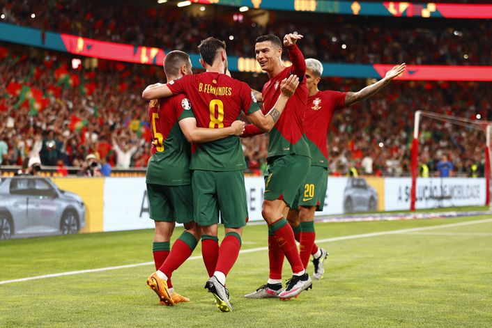 Bruno Fernandes celebrates his second Portugal goal of the match with his team-mates
