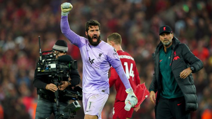 Alisson Becker celebrates after Liverpool's victory over Manchester City