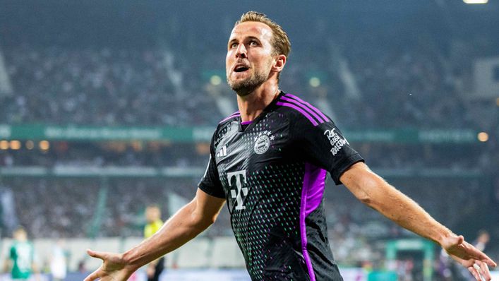 Harry Kane celebrates scoring on his Bundesliga debut