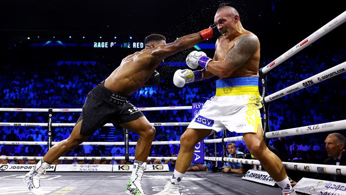 Anthony Joshua lunges into a punch to try and catch the elusive Oleksandr Usyk