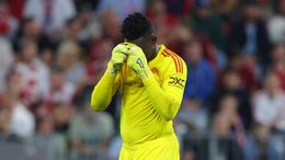 Andre Onana looks dejected after his mistake