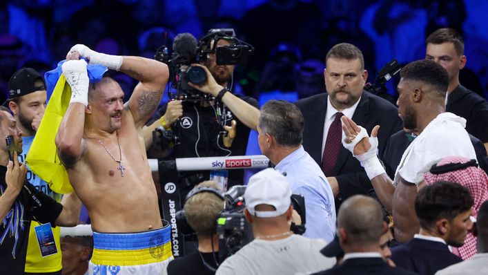 Oleksandr Usyk holds the Ukrainian flag after his fight with Anthony Joshua