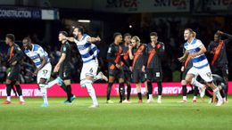 QPR players celebrate their winning penalty against Everton