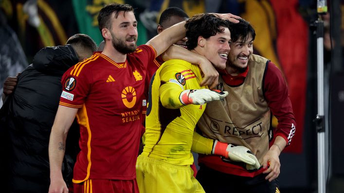 Mile Svilar was mobbed by his team-mates after his penalty shootout heroics