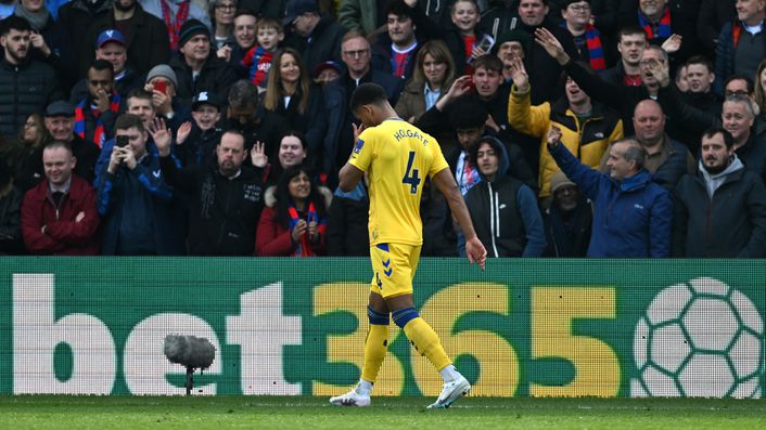 Mason Holgate leaves the pitch after receiving a red card