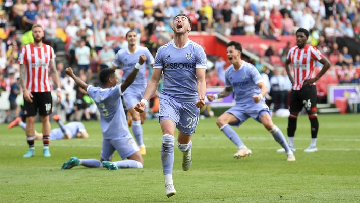 Jack Harrison wheels away in celebration after his stoppage-time winner