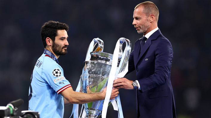 Aleksander Ceferin handed Manchester City the Champions League trophy after their triumph
