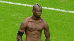 Mario Balotelli celebrates after netting his second goal of the match against Germany
