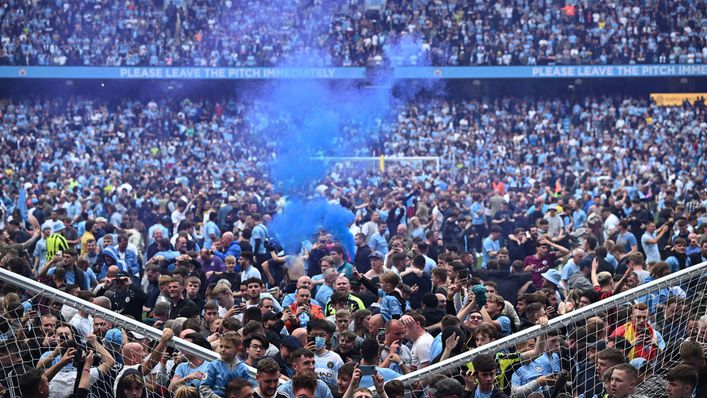 Fans of Manchester City invaded the pitch after they won the Premier League title
