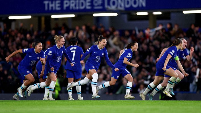 Chelsea players burst into celebration at the end of the penalty shootout