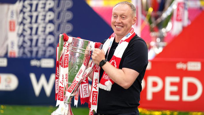 Steve Cooper got his hands on the Championship play-off trophy yesterday