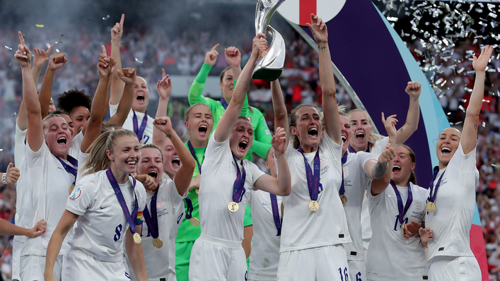 Ellen White holds the European Championship trophy aloft