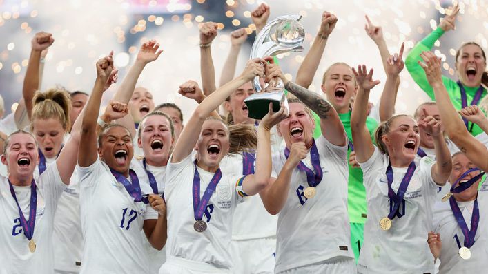 The jubilant Lionesses lift the European Championship trophy