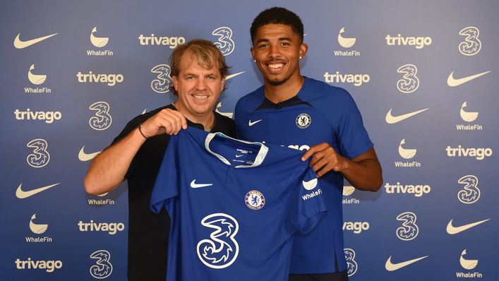 Todd Boehly and Wesley Fofana hold a Chelsea shirt after the defender completed his switch from Leicester